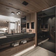 Vista alternativa del bagno nella suite per ospiti all'Chalet Gardena di Cortina Hospitality, con design elegante e funzionale